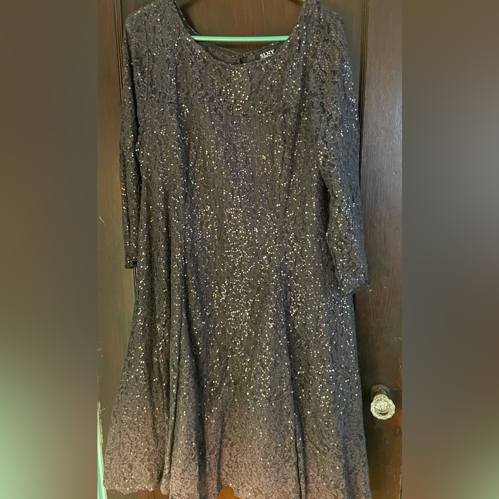 Sequined black party dress with net crinoline style underneath skirt.